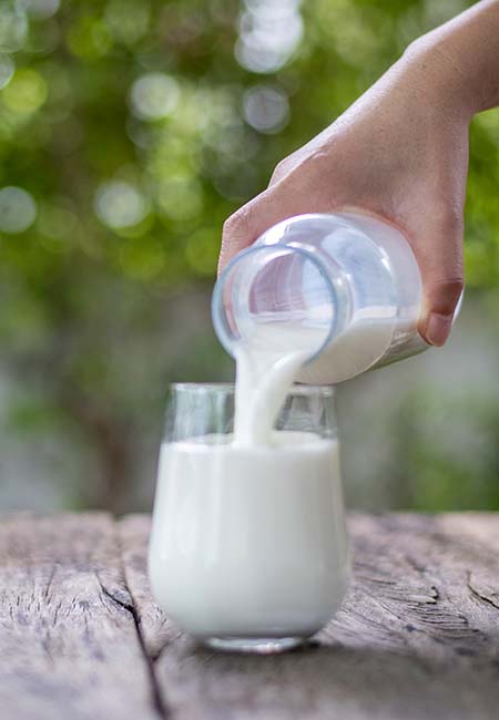 milk being poured into glass