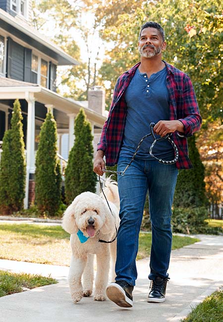 man walking dog