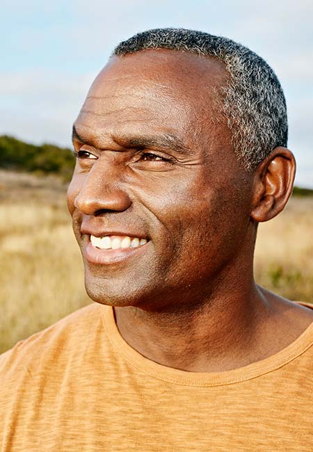 man outside looking into distance