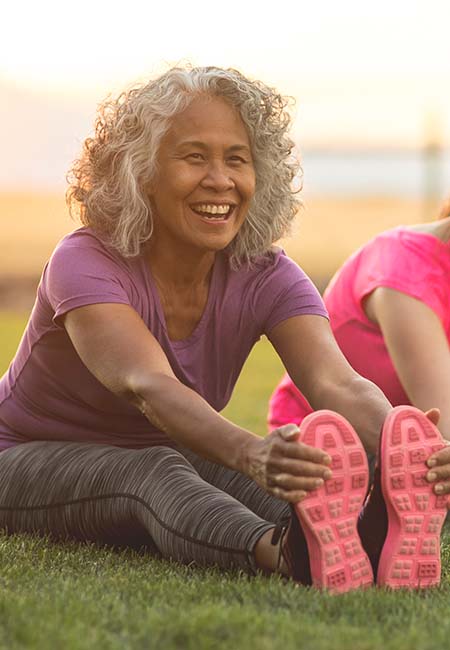 group stretching in park