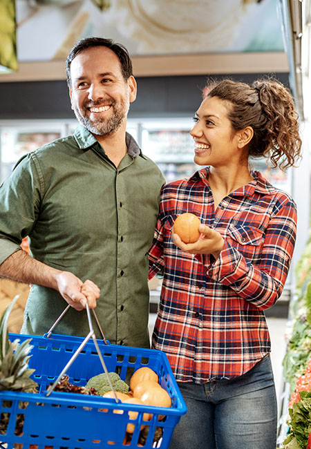 Couple shopping for produce
