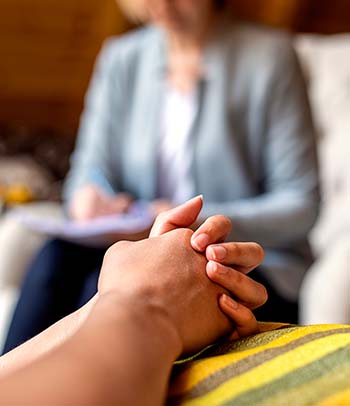 detail of hands at counseling session