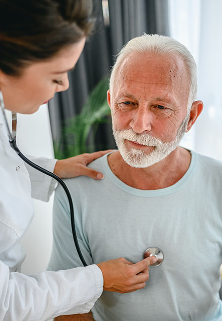 Doctor listening to patients heart