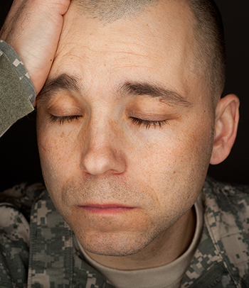 man holding his head