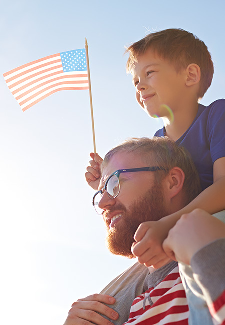 Father with son on shoulders