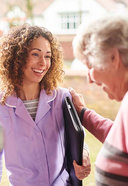 home nurse visiting female patient