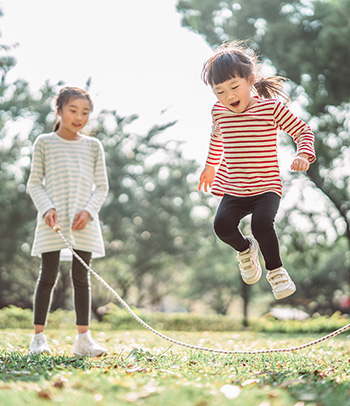 Two girls jumping rope