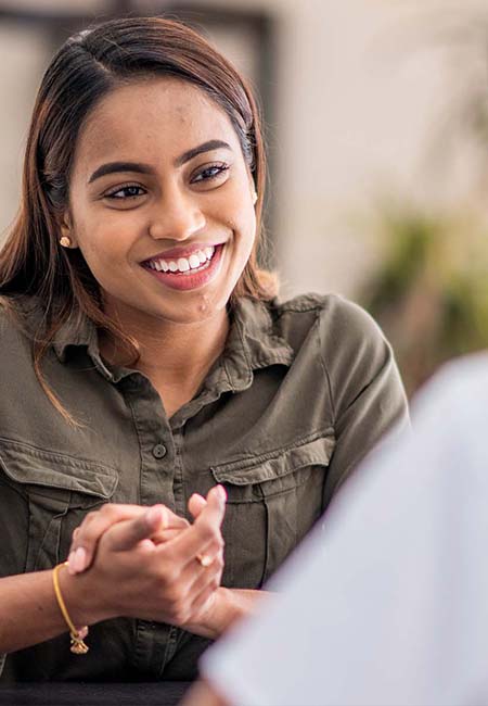 woman speaking with counselor