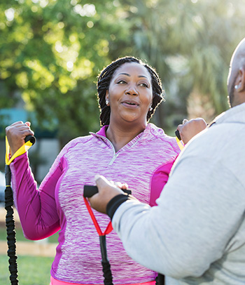 Couple exercising resistance bands