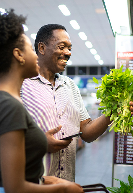 Father and daughter in supermarket