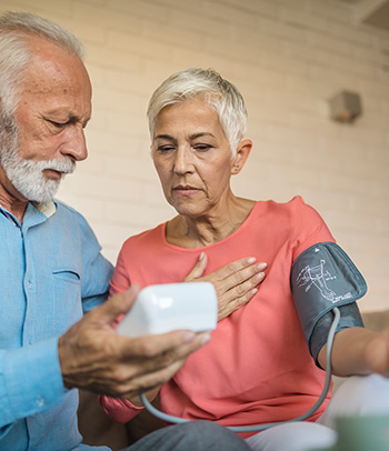 Senior couple measuring blood pressure