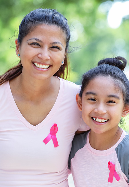 Mother and daughter walking for breast cancer awareness