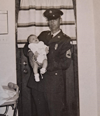 Vintage photo of father holding infant daughter