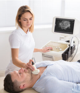 Female doctor performing thyroid ultrasound test