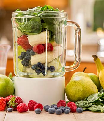 Green smoothie ingredients in blender