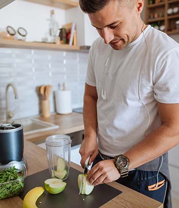 Man making smoothie before workout