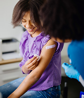 Teen girl receiving HPV vaccine