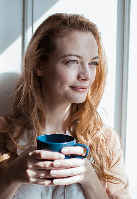 Woman enjoying cup of coffee