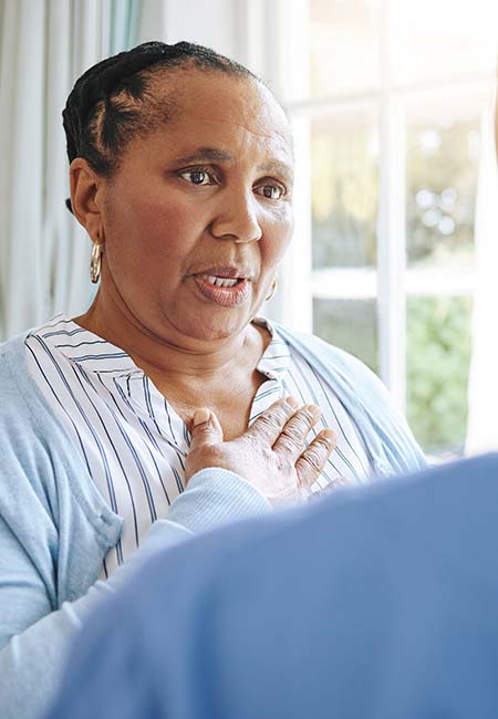 Woman speaking with her nurse
