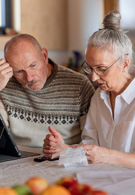 Senior couple going over finances toget