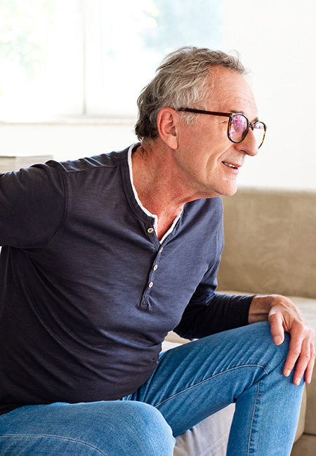Senior man suffering from kidney pain.
