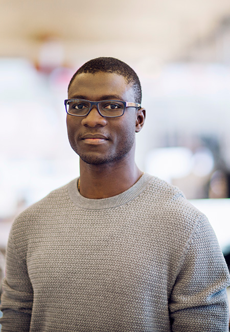 Man in office looking directly at camera.