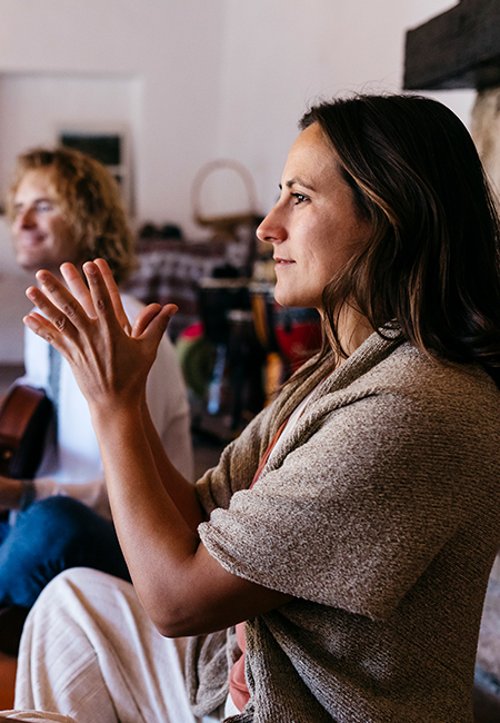 Woman exercising at music therapy in farmhouse.
