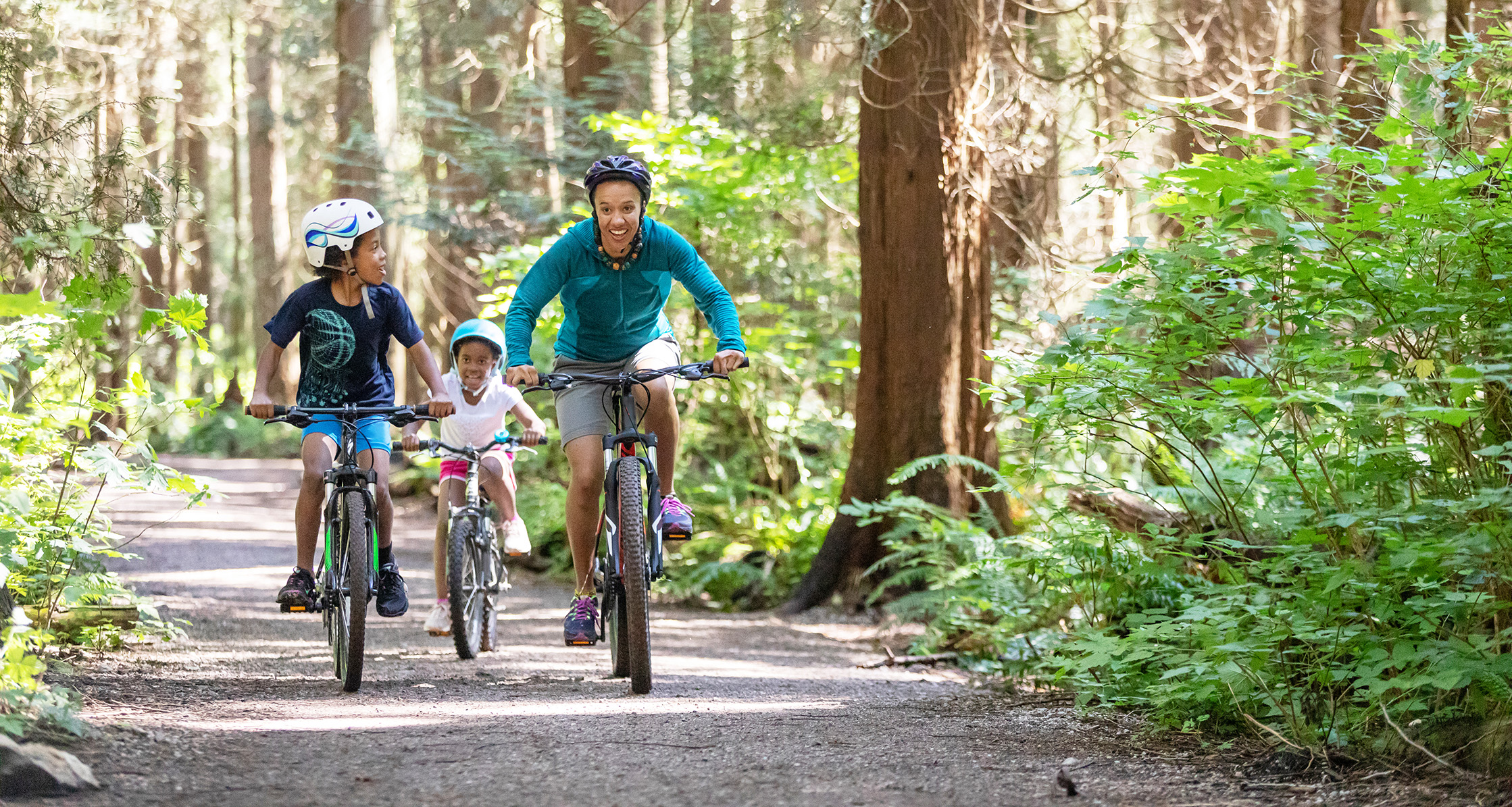 Mom and kids riding bikes.