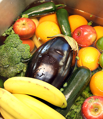 Washing fruits and vegetables.