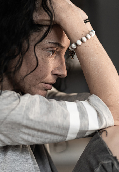 Woman struggling from a mental breakdown.