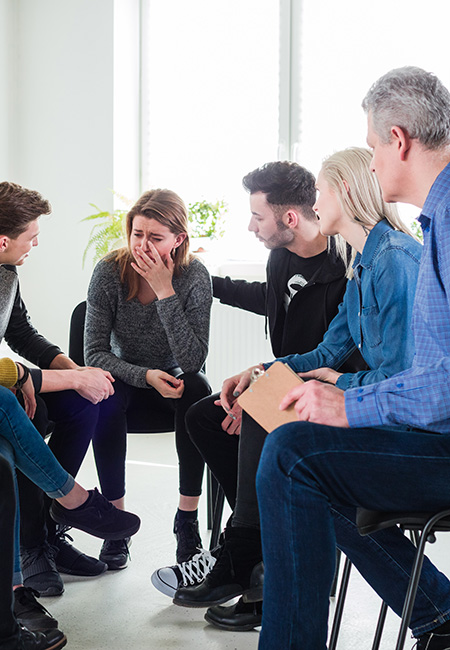 Depressed woman with friends and therapist.