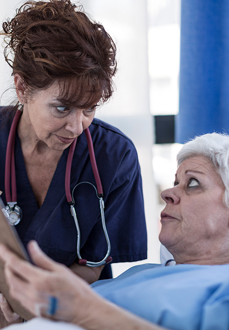 Doctor explaining patient’s advance directive.