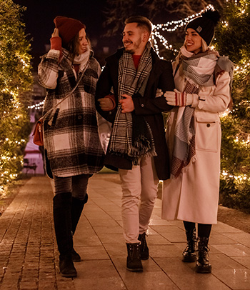 Friends taking a walk after eating dinner.