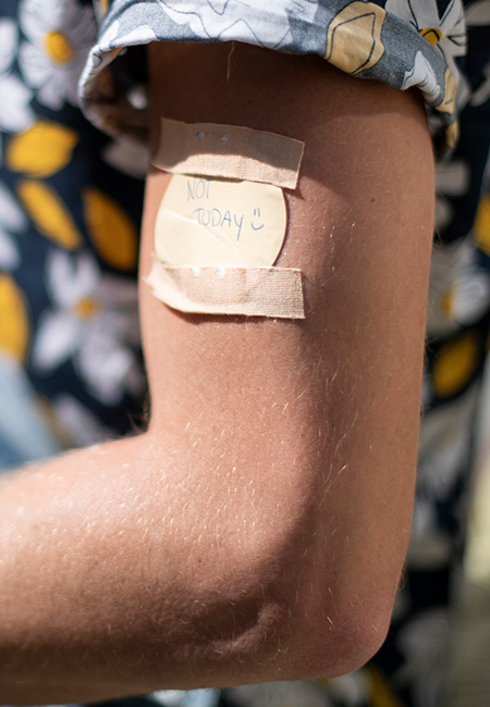 Man wearing a nicotine patch.