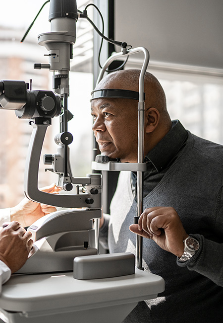 Ophthalmologist examining patient’s eyes.