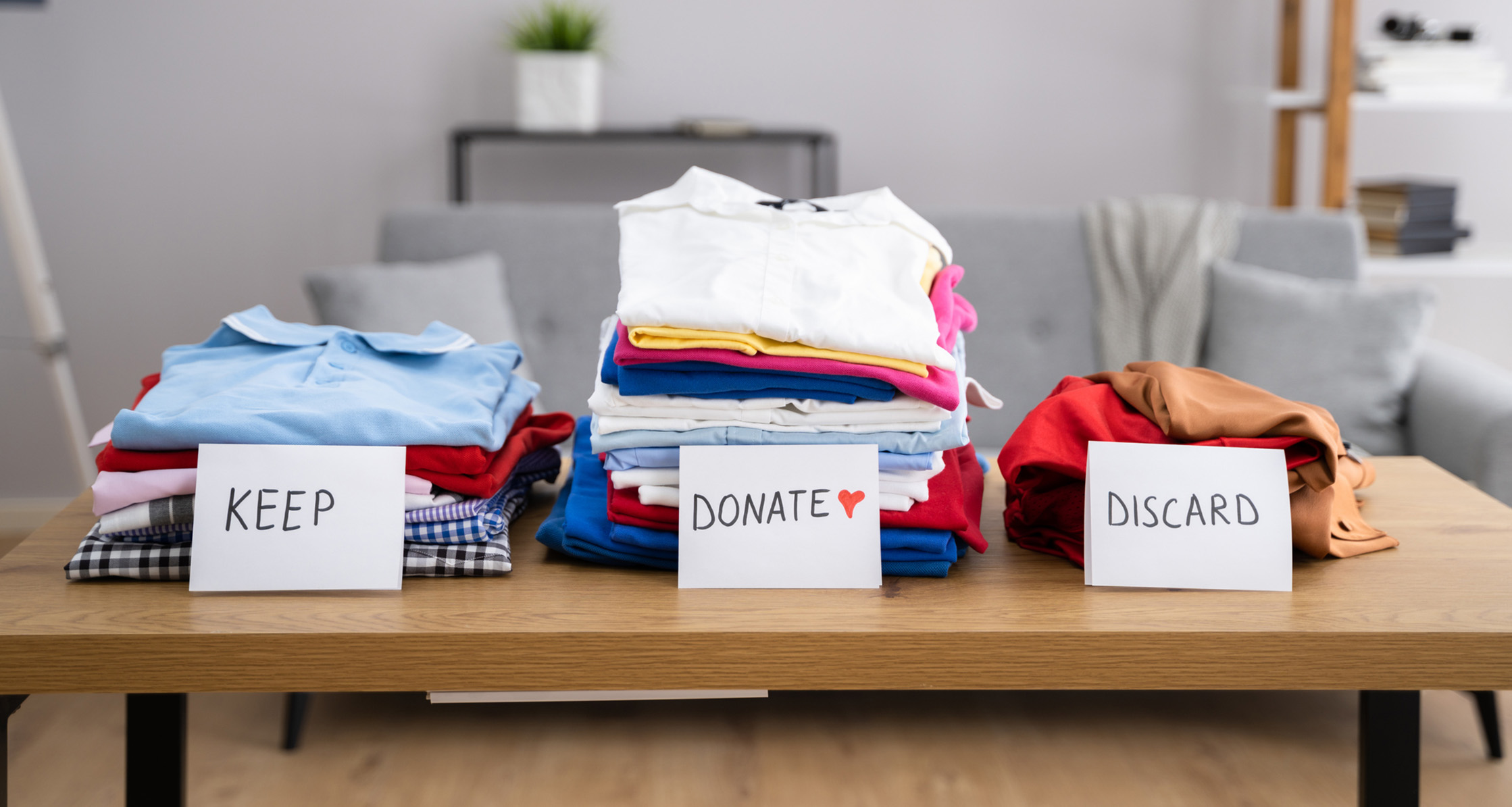 Decluttering wardrobe as part of spring cleaning routine.