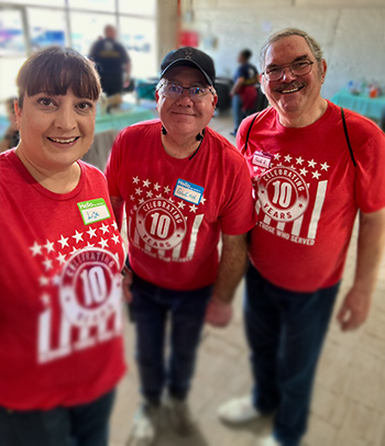 Glenn Gray, TriWest VP of Military & Veteran Engagement, is pictured with volunteers.