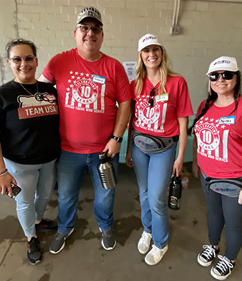 Gregory Kay pictured with his wife and other volunteers at the Maricopa County StandDown event.