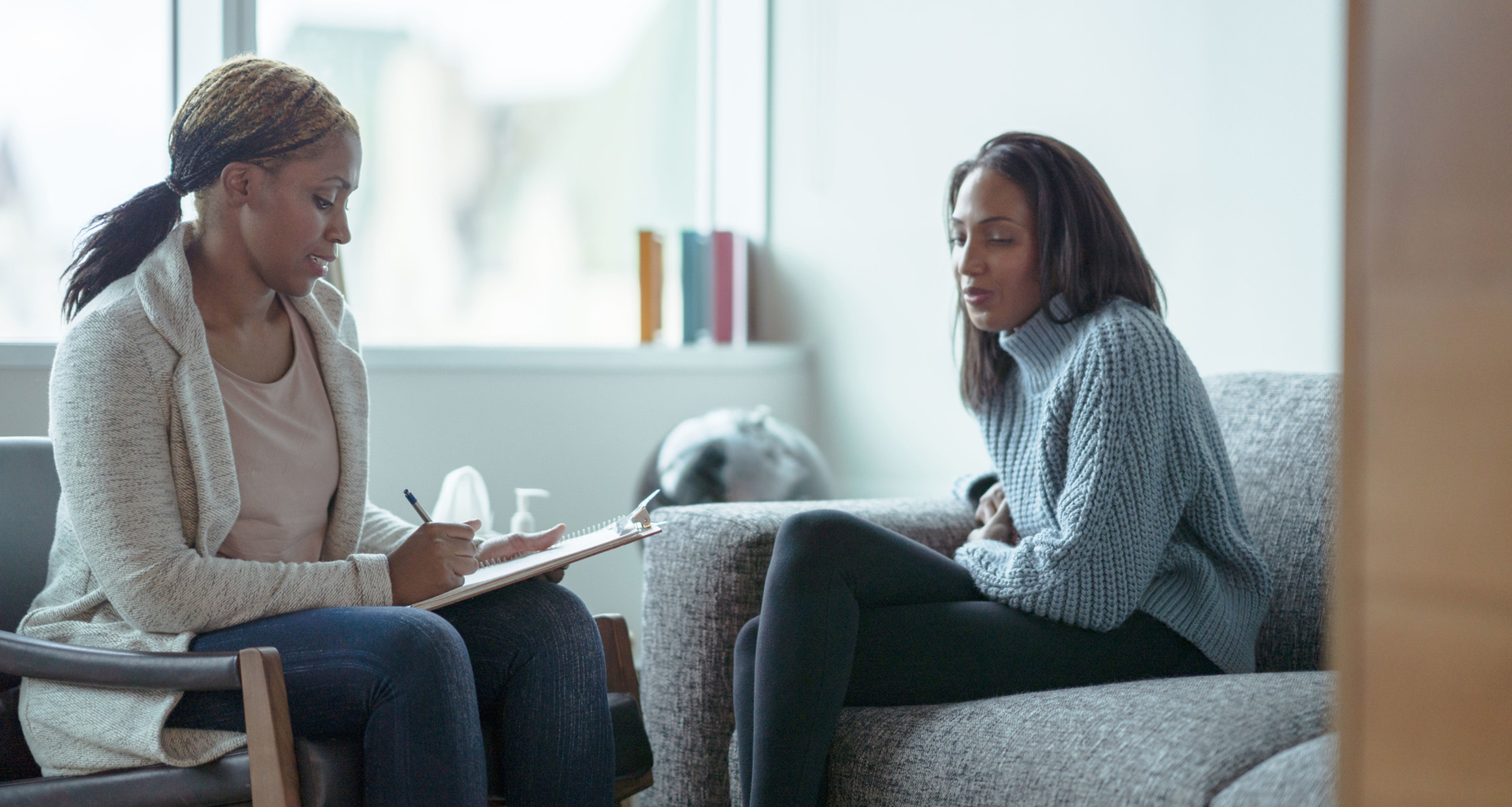 Woman sitting in a counseling appointment.