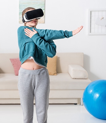 Women wearing VR headset while exercising at home.