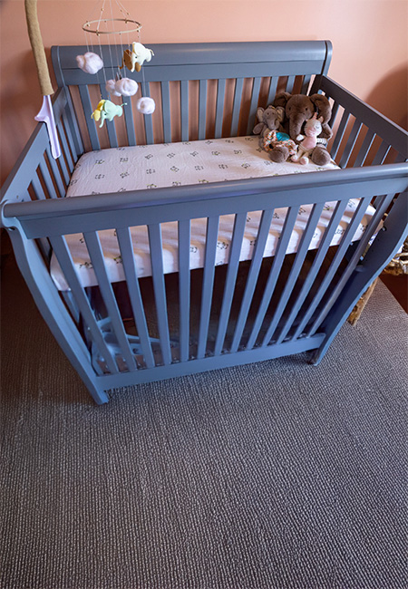 An empty crib symbolizes the loss of a child.