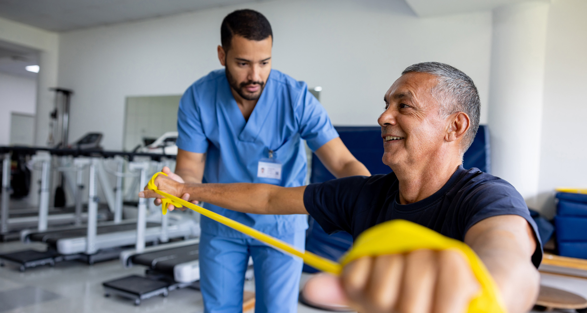 A retired Veteran undergoing physical therapy with a therapist.