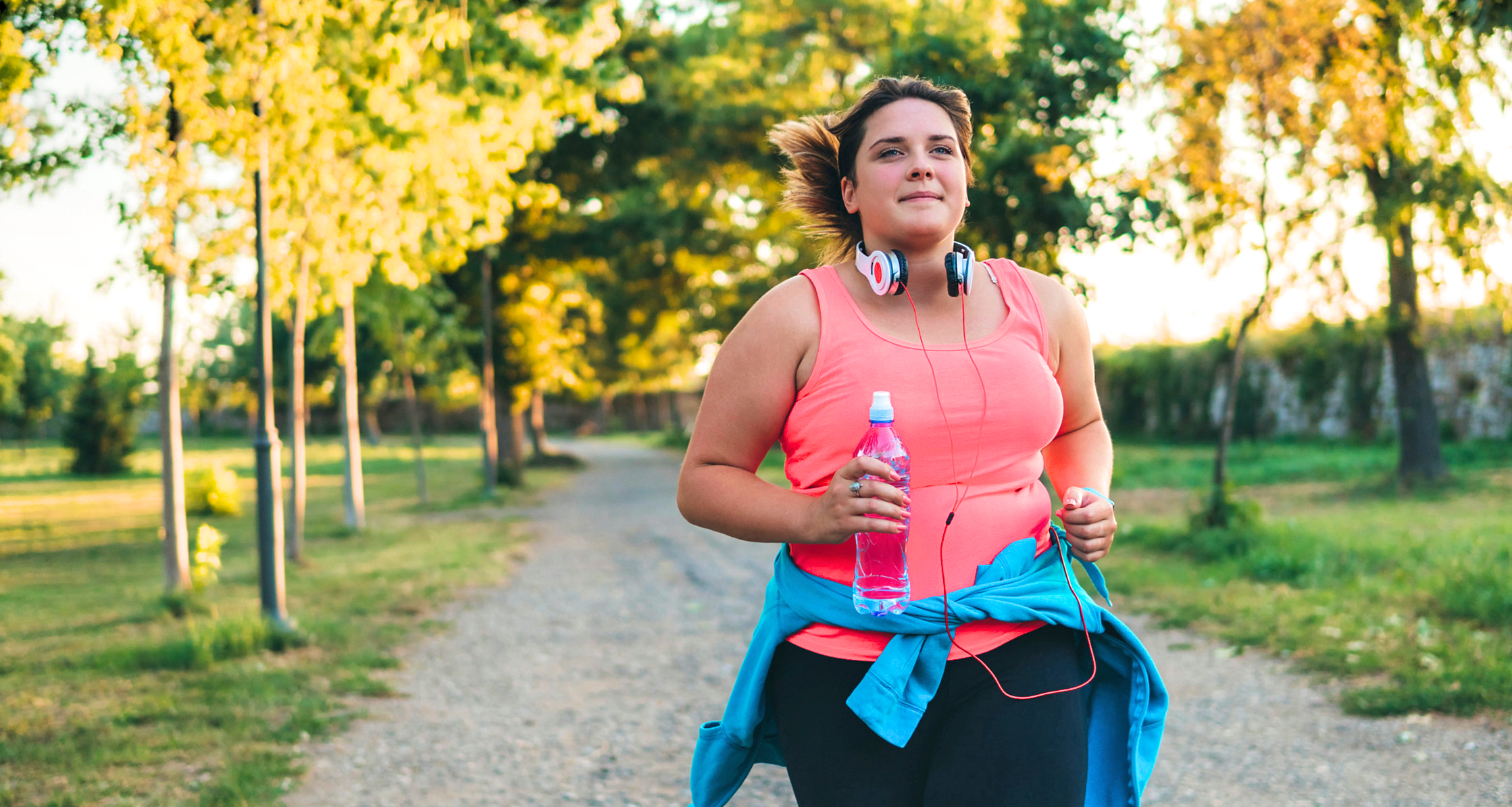 A woman is jogging in the spring.