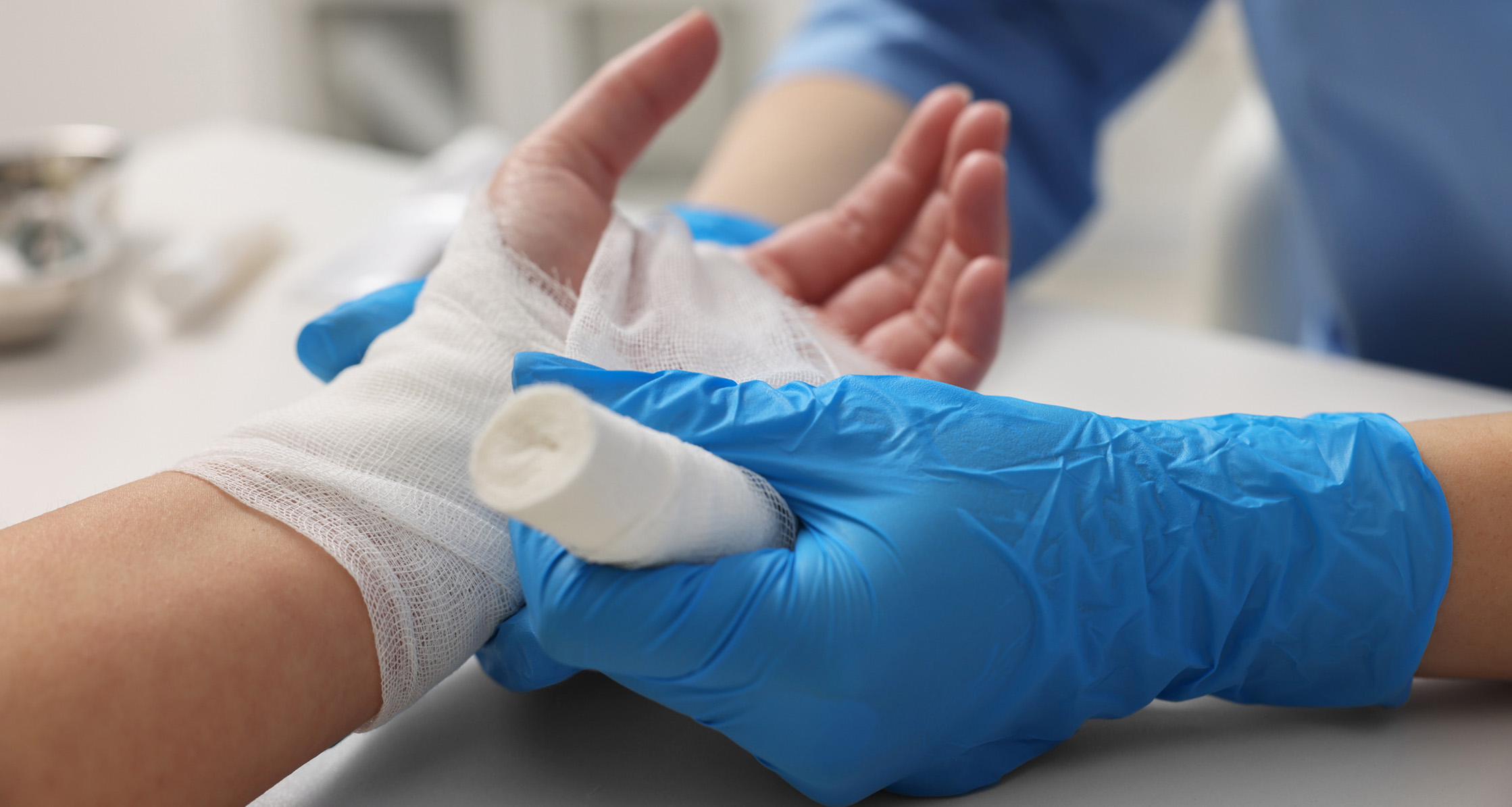 Doctor bandaging a patient’s burn.