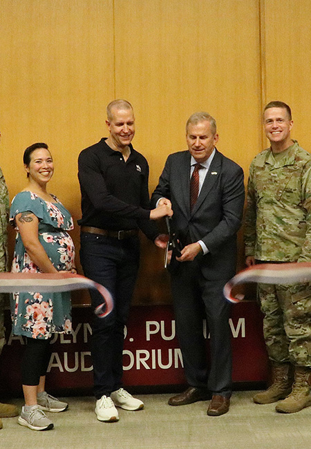 The ribbon-cutting ceremony for the grand opening of the new children’s waiting room.