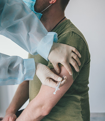 A man getting vaccinated for meningitis.