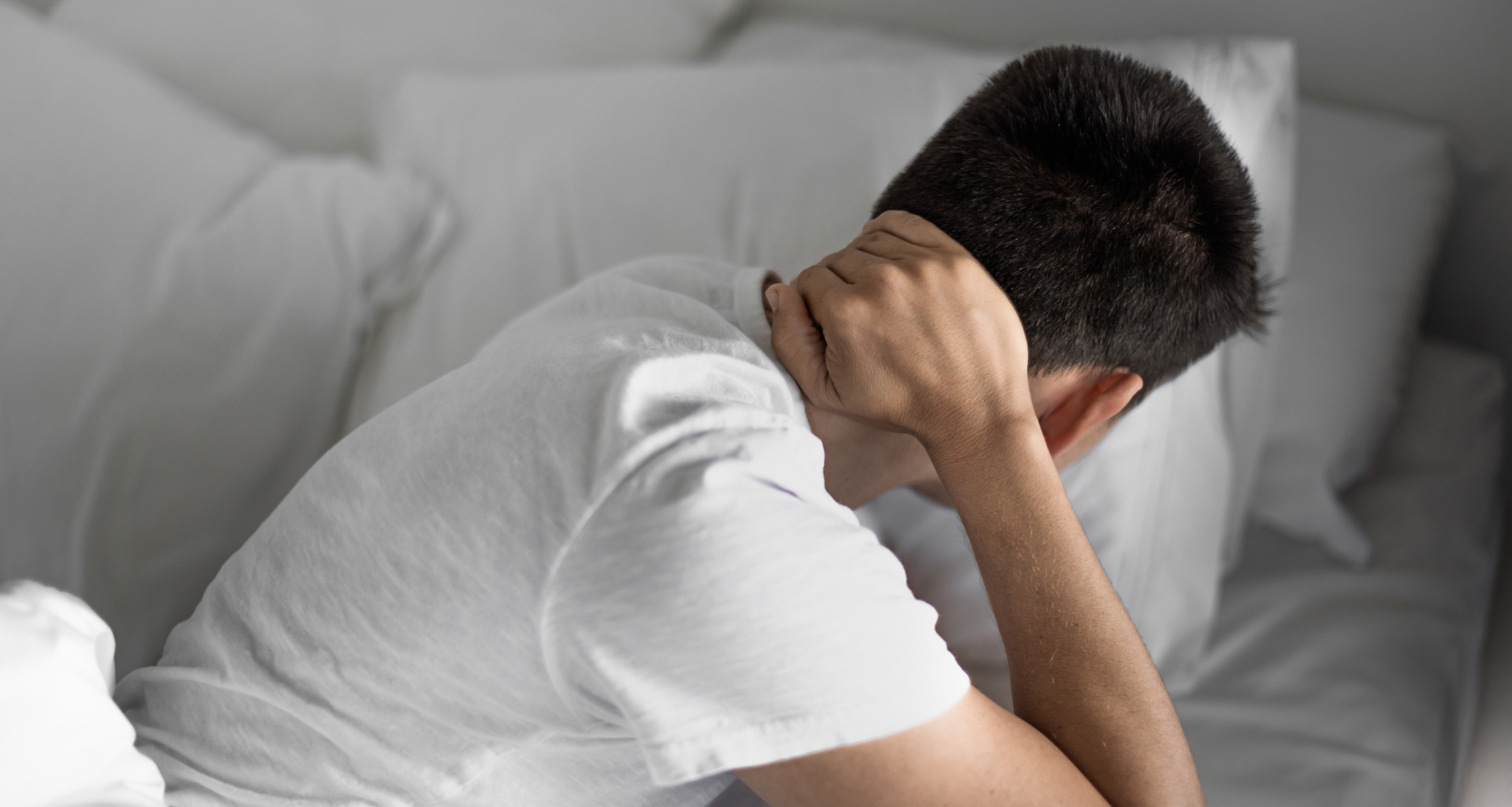 Man with stiff neck pain.