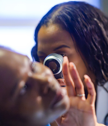 Dermatologist using a dermatoscope examines a patient’s skin for signs of skin cancer.