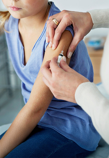 A child getting a measles vaccine.