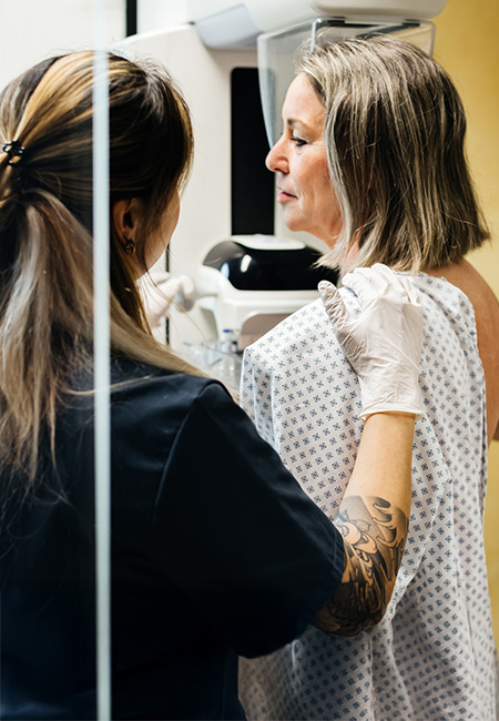 Woman undergoes a mammogram.